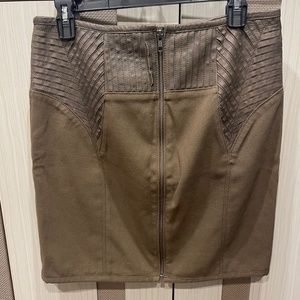 The designer great looking olive pencil skirt with brown leather attachments.